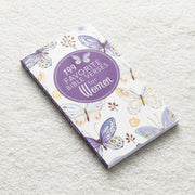 Notebook titled '199 Favorite Bible Verses for Women' with butterfly designs on a textured surface