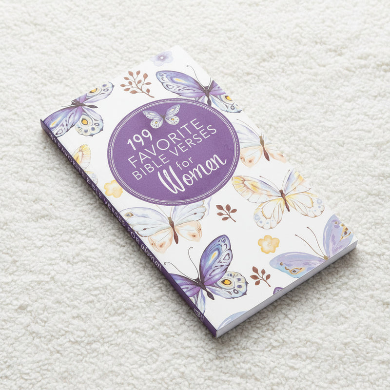 Notebook titled '199 Favorite Bible Verses for Women' with butterfly designs on a textured surface