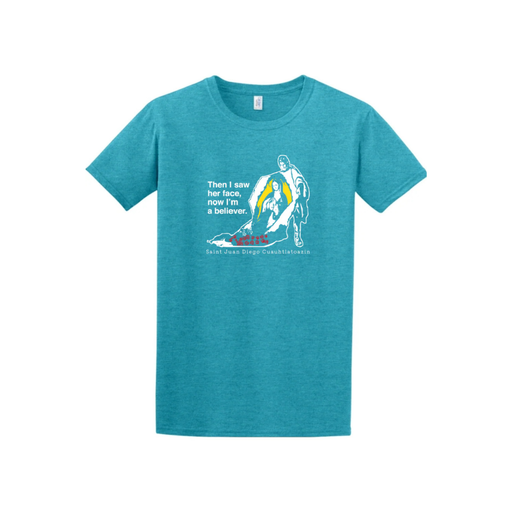 Blue t-shirt with white graphic of Our Lady of Guadalupe and text reading 'Then I saw her face, now I'm a believer' on a white background