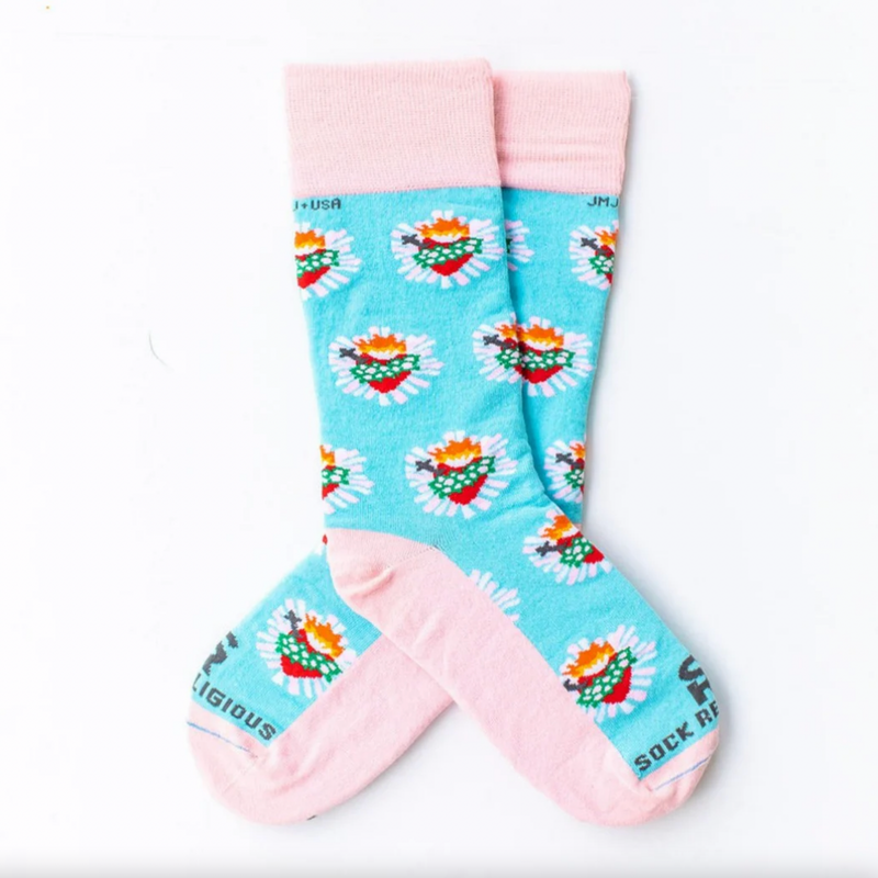 Pastel pink and blue socks with images of the Immaculate Heart of Mary