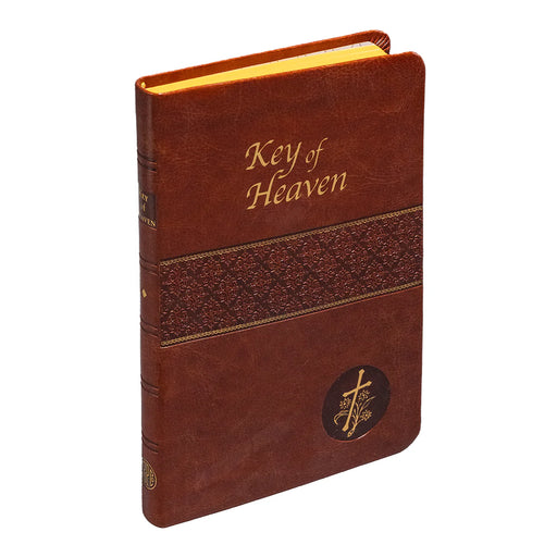 Brown leather book titled 'Key of Heaven' on a white background