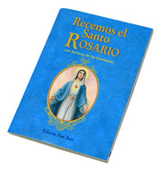 Blue book titled 'Recemos el Santo Rosario' with a portrait of a religious figure on the cover.