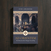 Book cover of 'Ad Orientem' by Peter A. Kwasniewski on a wooden surface