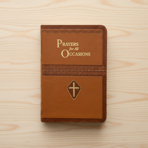 Brown prayer book with 'Prayers for All Occasions' text and cross emblem on a pine wood background