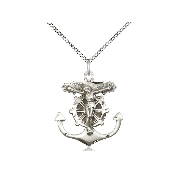 Silver pendant with anchor design and crucifixion figure on a white background