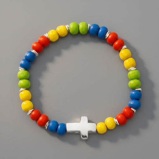 Colorful beaded bracelet with a silver cross charm on a gray background