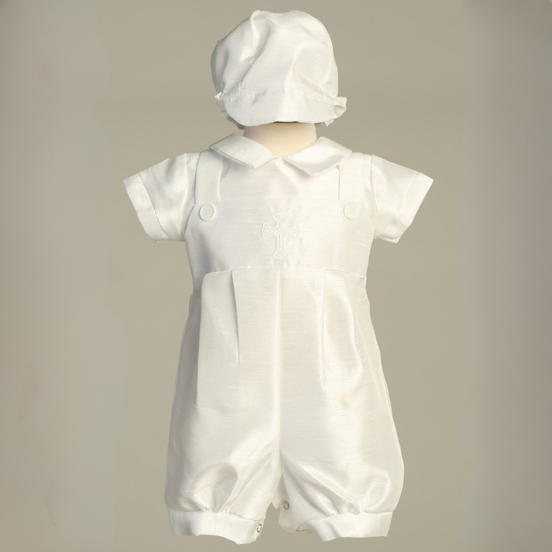 White baptism romper on a gray background