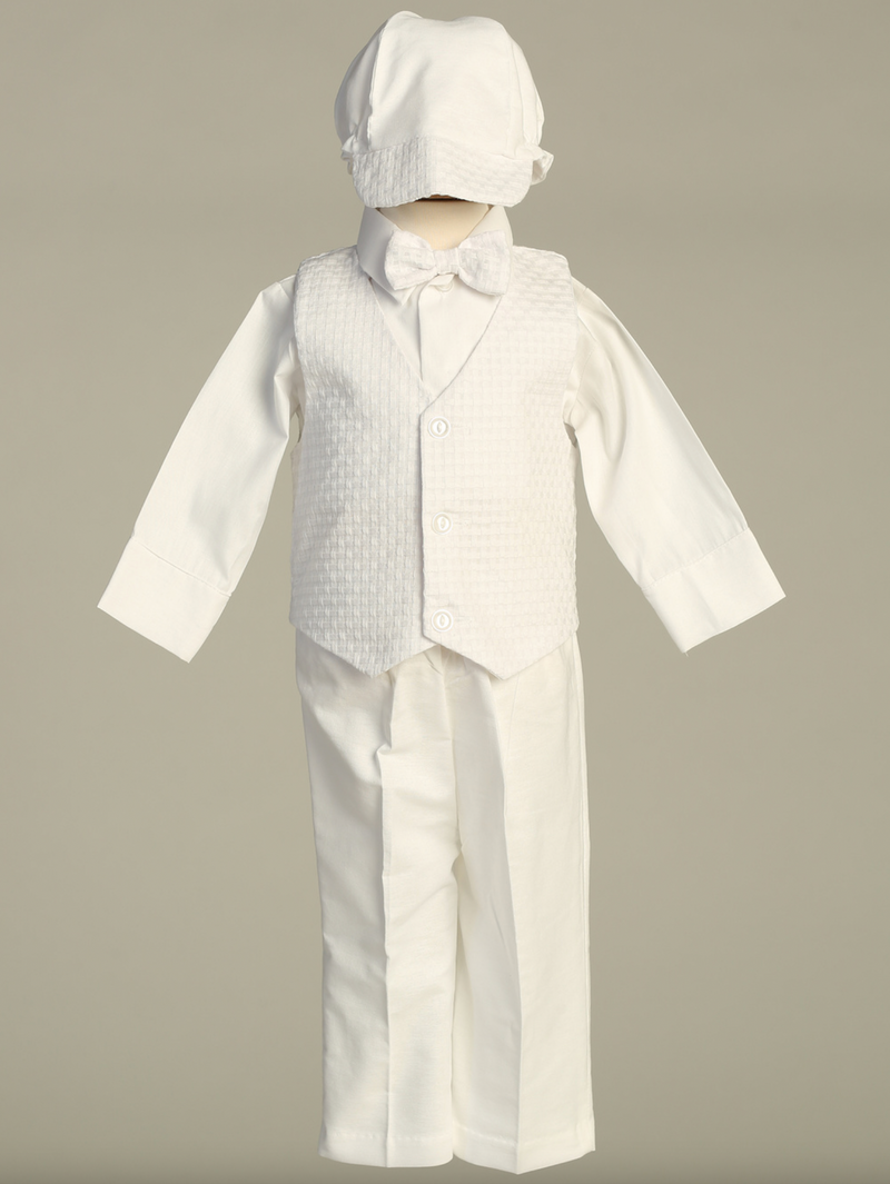 White formal baptism outfit with vest, shirt, pants, and hat on a gray background