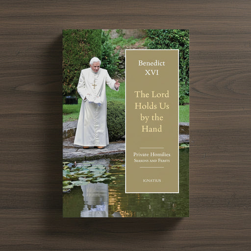 Green book by Pope Benedict XVI on a dark wood background