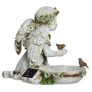 Statue of an angel with wings and a solar panel, holding a bowl with birds on a white background