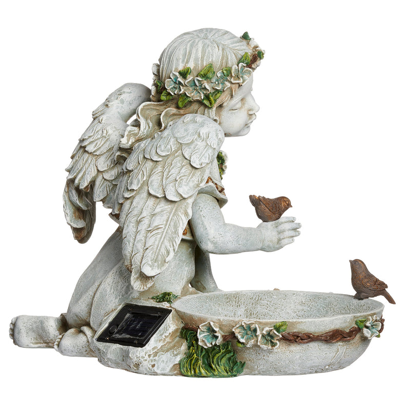 Statue of an angel with wings and a solar panel, holding a bowl with birds on a white background