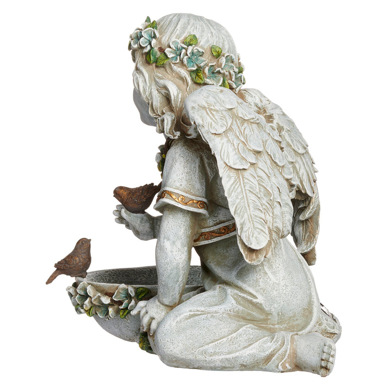 Statue of an angel with wings and birds on a white background