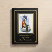 Book titled 'Remembrance of My First Holy Communion' with a religious illustration on a wooden surface