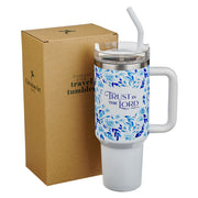 White travel tumbler with blue floral design and 'Trust in the Lord' text, next to a cardboard box.