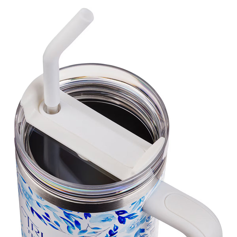Close-up of an insulated mug with a straw lid on a white background