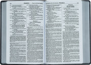 Open Bible showing Psalms 23 and 24 with a black cover