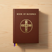 Book of Blessings with a cross symbol on a wooden surface