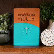 Brown and teal youth Bible on a wood shelf