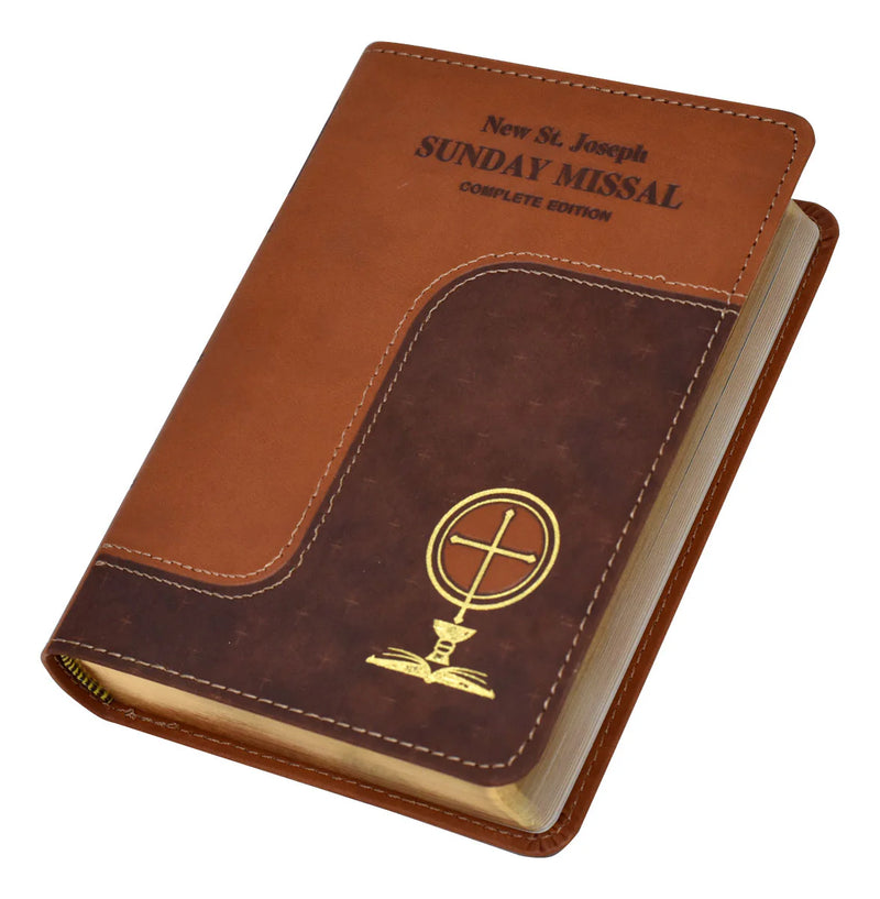Brown leather-bound book titled 'New St. Joseph Sunday Missal Complete Edition' on a white background