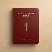 Red New Catholic Bible with gold text and cross on a wooden surface