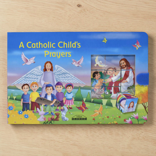 Children's book titled 'A Catholic Child's Prayers' on a wooden surface