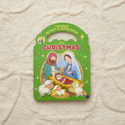 Catholic activity and sticker book about Christmas on a textured beige surface