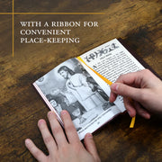 Open book with a ribbon bookmark on a wooden surface, text 'WITH A RIBBON FOR CONVENIENT PLACE-KEEPING' above.