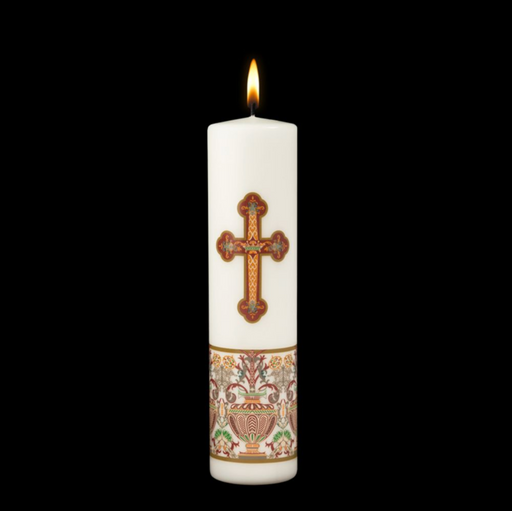 Decorative candle with a cross design on a white background