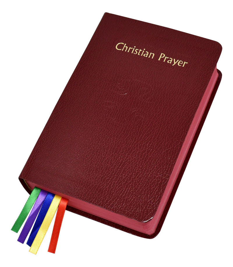 Maroon prayer book with colorful ribbons on a white background