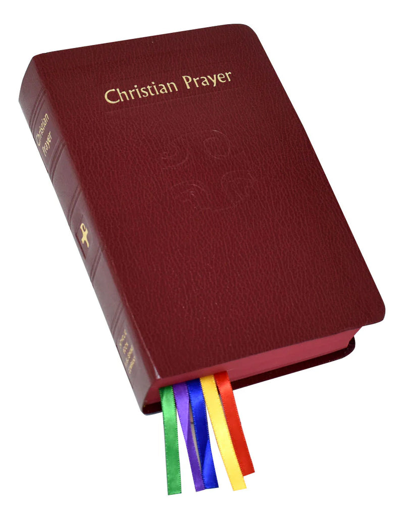 Red prayer book with rainbow ribbons on a white background