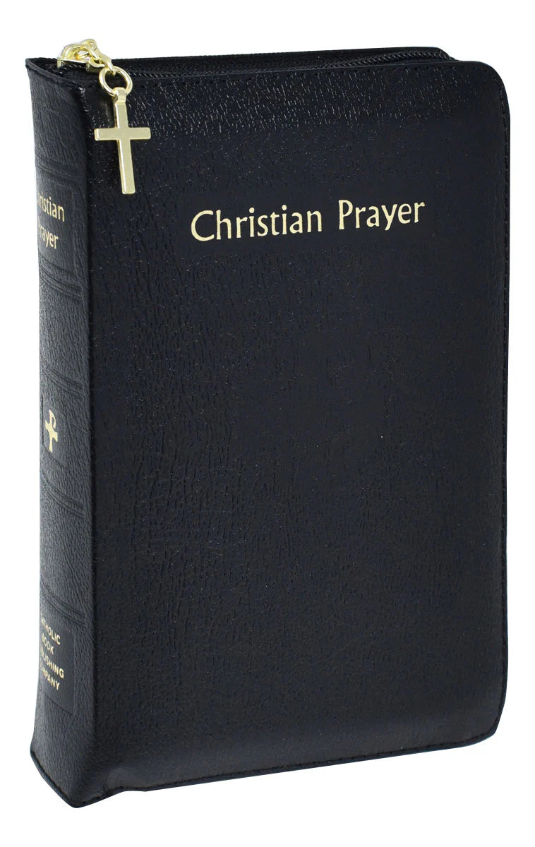 Black prayer book with gold cross and text on a white background