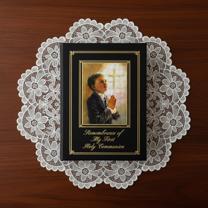 Book titled 'Remembrance of My First Holy Communion' with a praying child illustration on a lace doily.