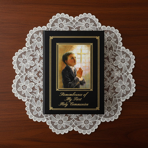 Book titled 'Remembrance of My First Holy Communion' with a praying child illustration on a lace doily.