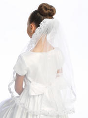 First Communion veil with corded lace trim, featuring an image of Our Lady of Guadalupe on the back.
