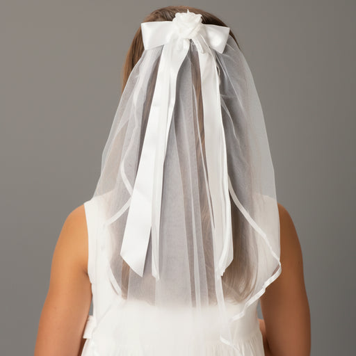 White veil with a large bow on a plain background