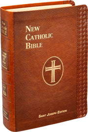 Brown leather-bound New Catholic Bible with gold cross emblem on a white background