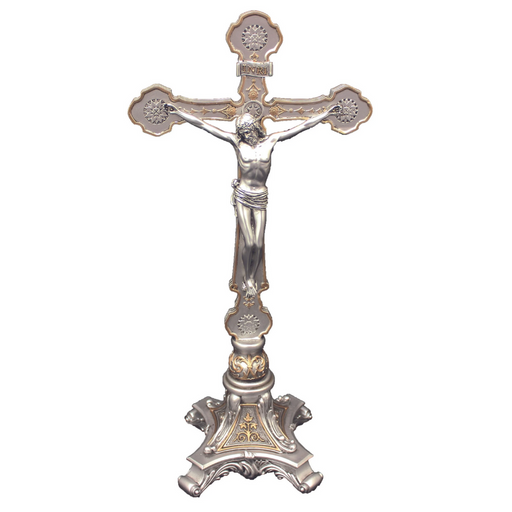 Decorative silver crucifix on a white background