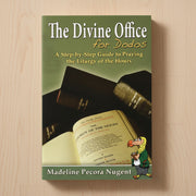 Book titled 'The Divine Office for Dodos' on a wooden surface