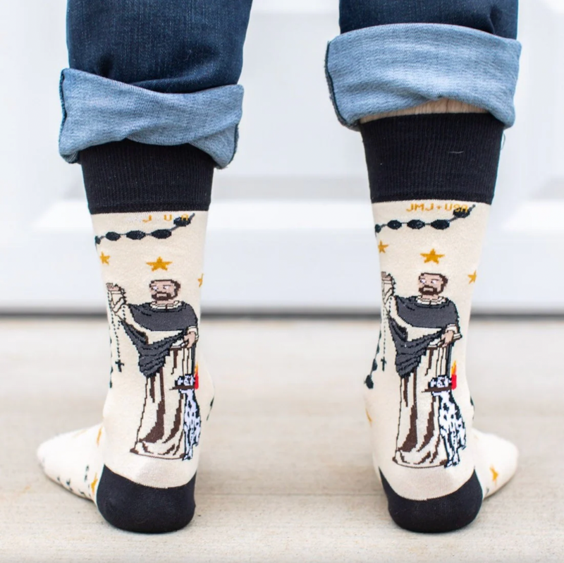 Person wearing crew socks with St. Dominic and a rosary graphic