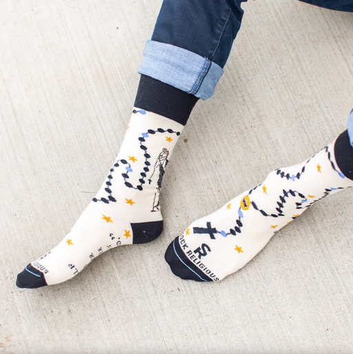 Person wearing crew socks with St. Dominic and a rosary graphic