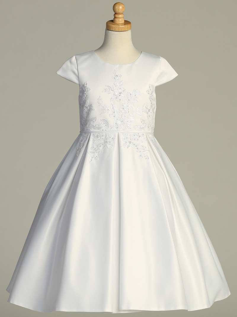 White Communion dress with floral lace details on a mannequin against a gray background