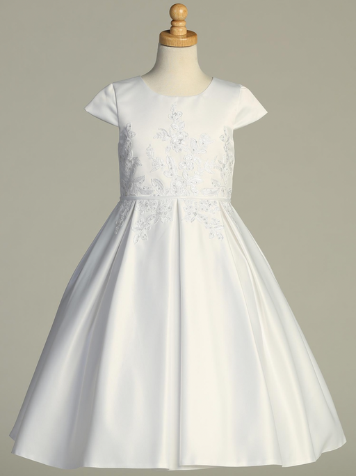 White Communion dress with floral lace details on a mannequin against a gray background