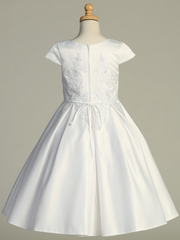White Communion dress on a mannequin against a gray background