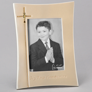 Gold First Communion picture frame with a cross, displaying a 4x6 inch black and white photo of a boy in a suit, on a gray background.