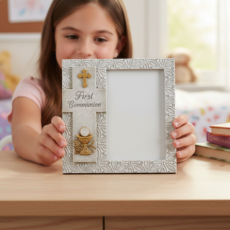 Little girl holding a 'First Communion' picture frame for holding a 4x6 inch photo, with a decorative cross and chalice design.