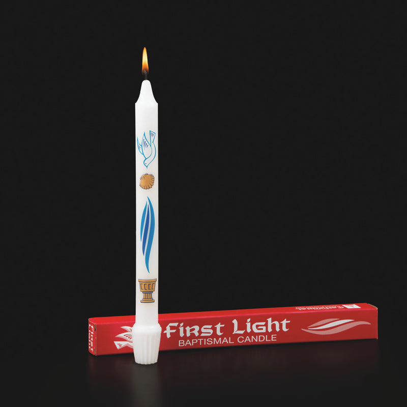Baptismal candle with decorative design and 'First Light' packaging on a black background