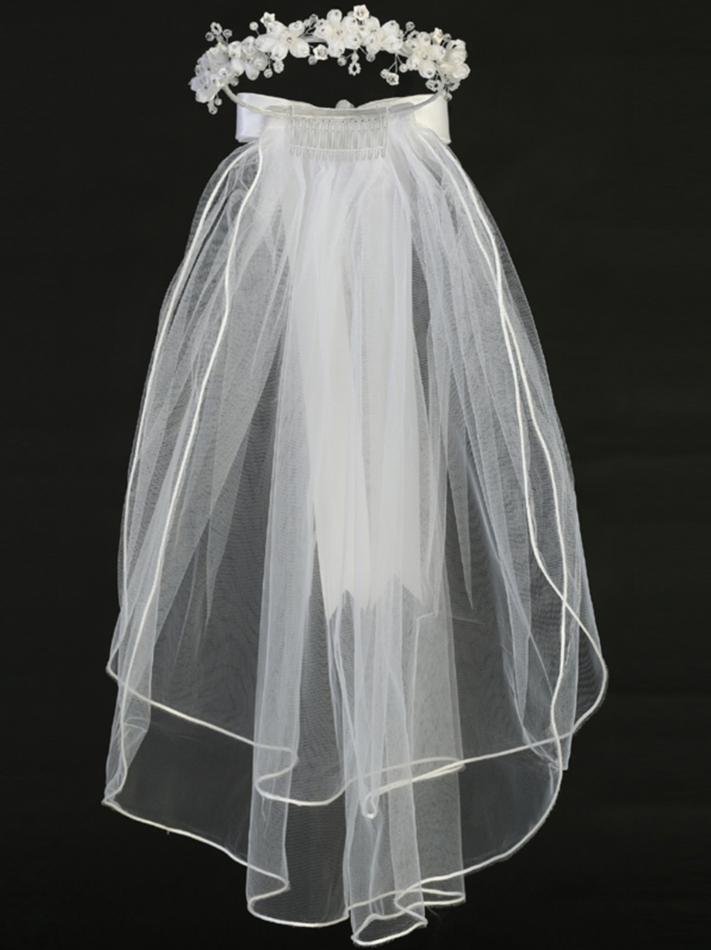 Full view of a little girl's rhinestone floral white sheer First Communion veil