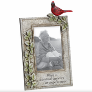 Decorative picture frame with a red cardinal on top, featuring a photo of a woman and text.