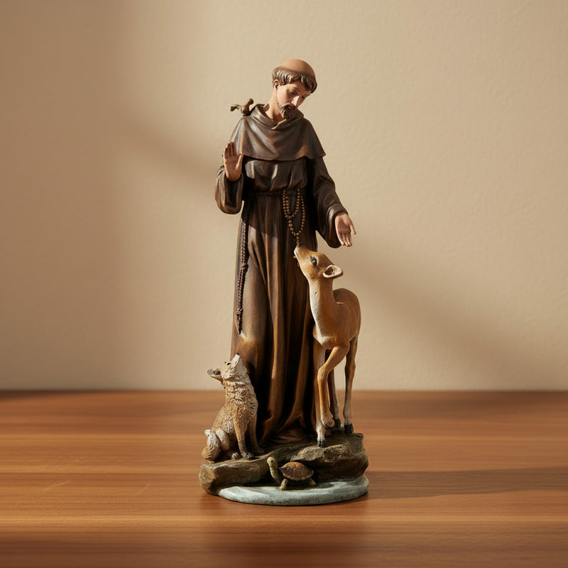 Statue of a religious figure with animals on a wooden surface