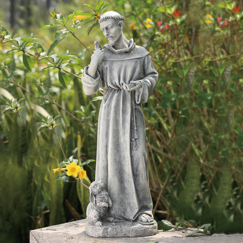 Statue of a religious figure with a rabbit in a garden setting